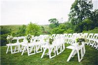 Lovely flowers and white chairs